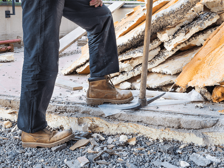 Professional roof services including cleaning, repairs, and painting on a residential property