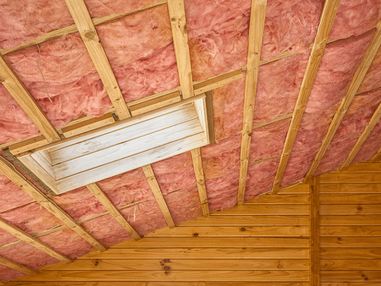 Fibreglass insulation installation to improve energy efficiency and reduce heat loss
