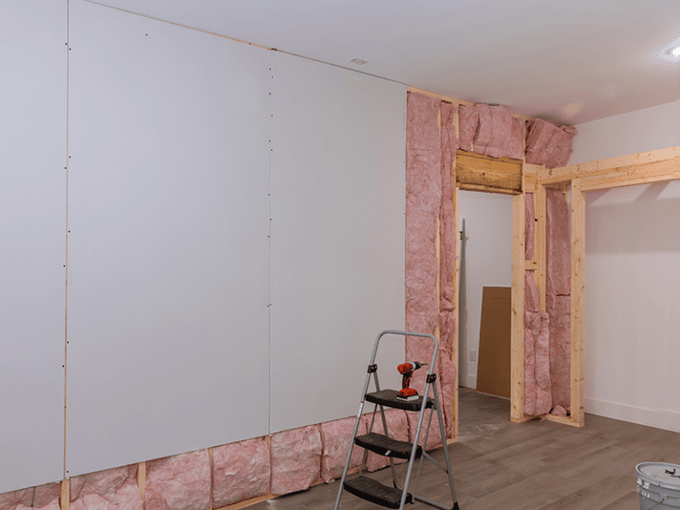 Fibreglass insulation installation to improve energy efficiency and reduce heat loss